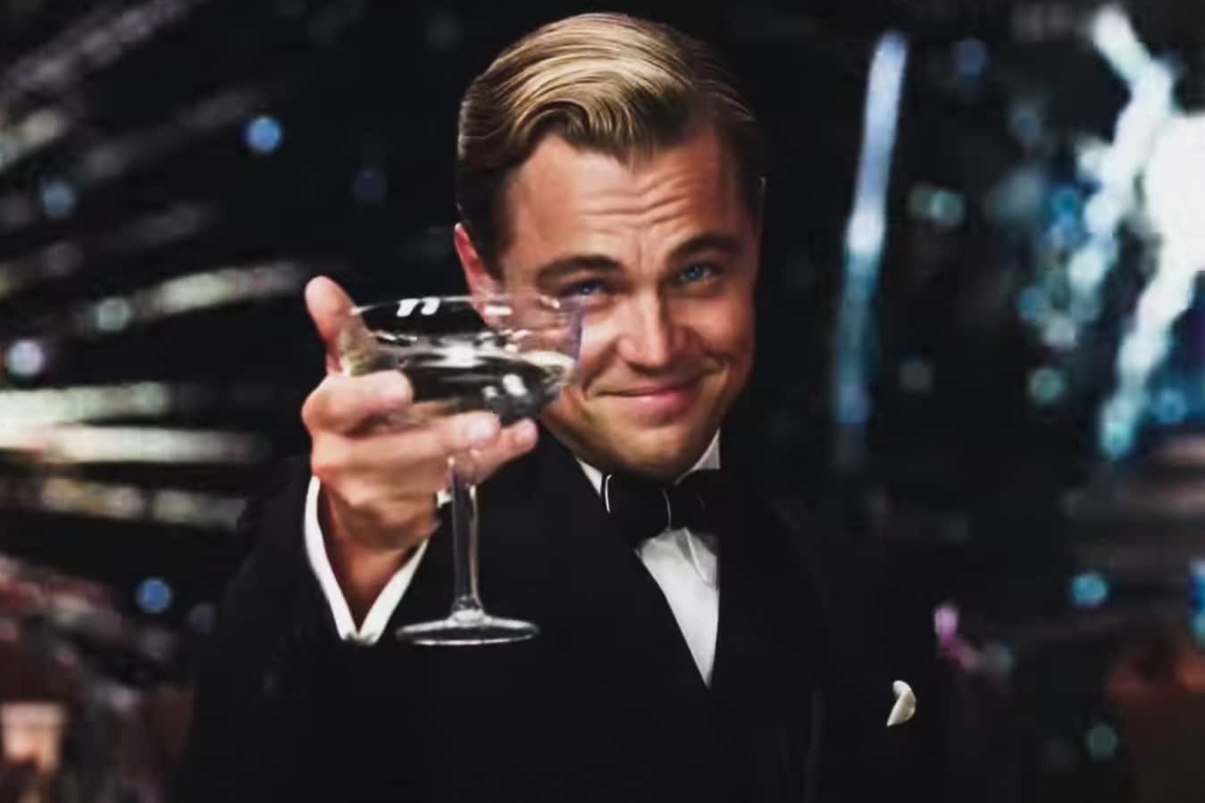 leonardo dicaprio as gatsby with a champagne coupe