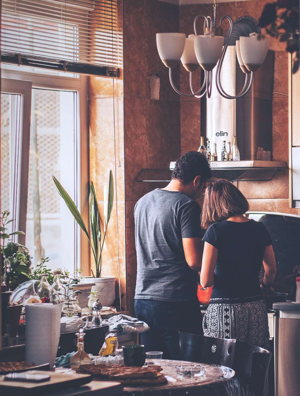 couple cooking in kitchen