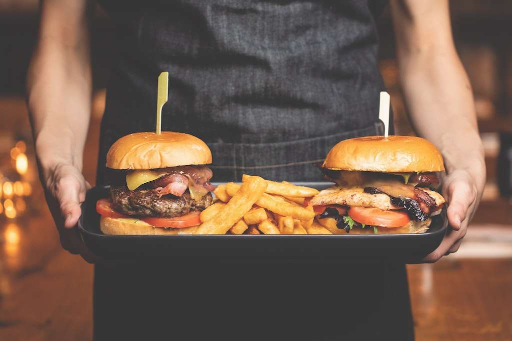 burgers and fries on a tray