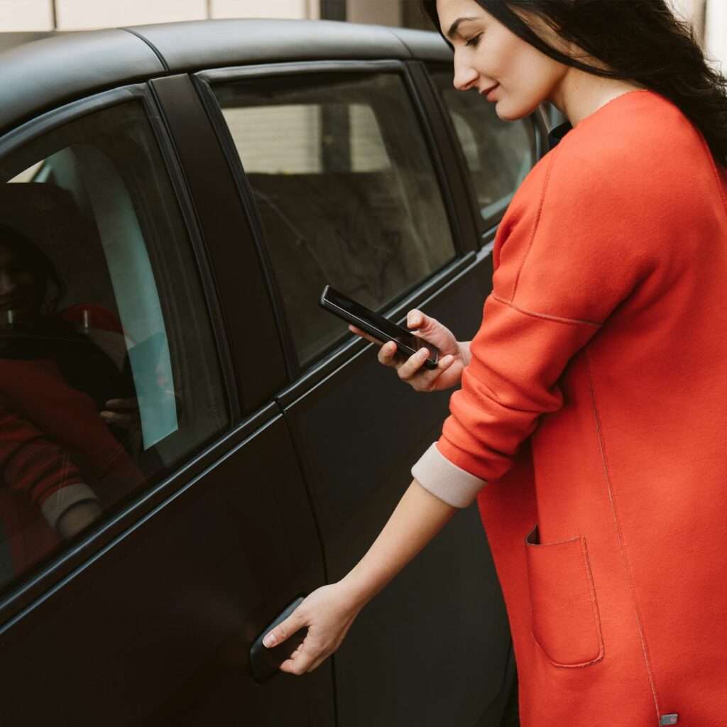Sion electric car and woman in red