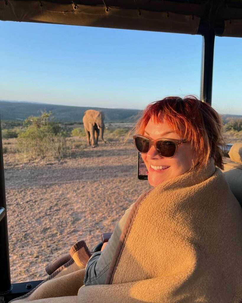 smiling at an elephant