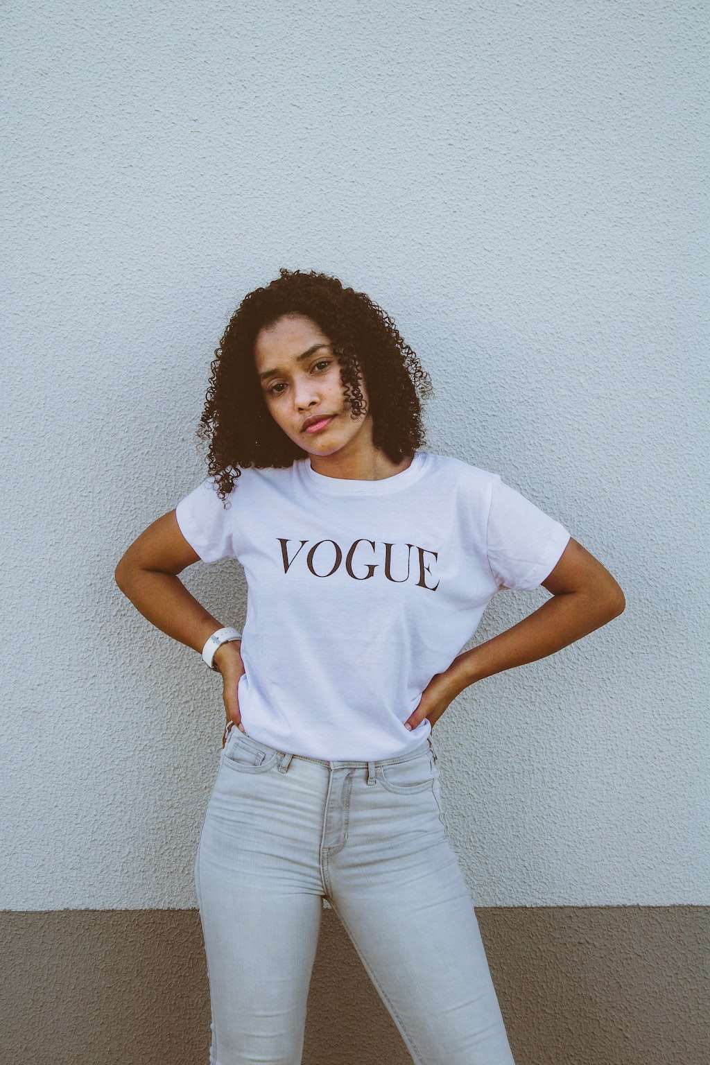 woman wears a vogue t-shirt