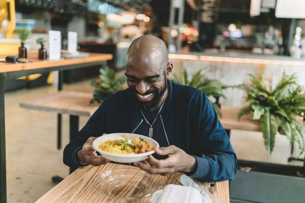man with bowl of food