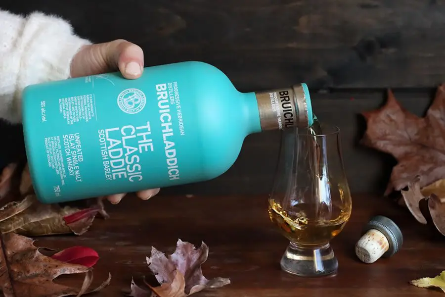 Pouring Bruichladdich whisky into a glass. 