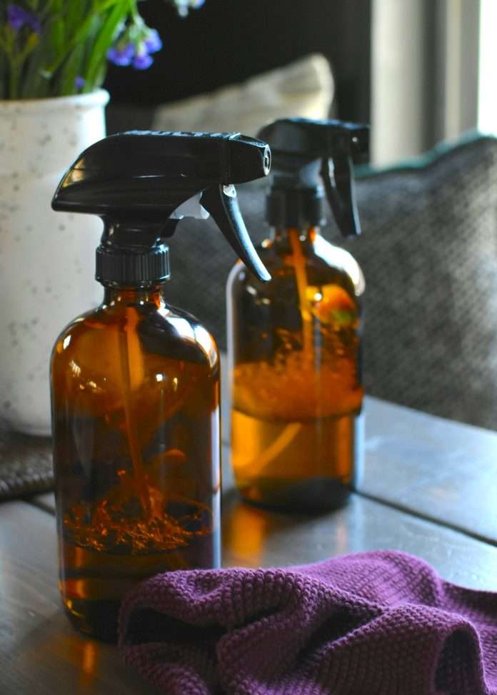 Brown cleaning spray bottles.
