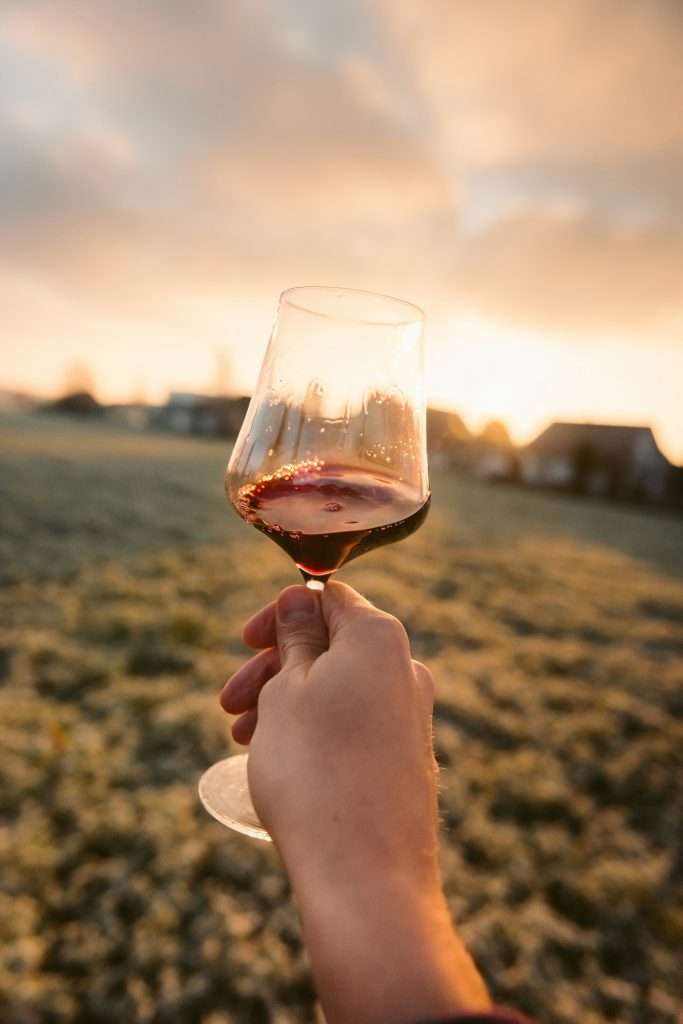Wine in a glass outside.
