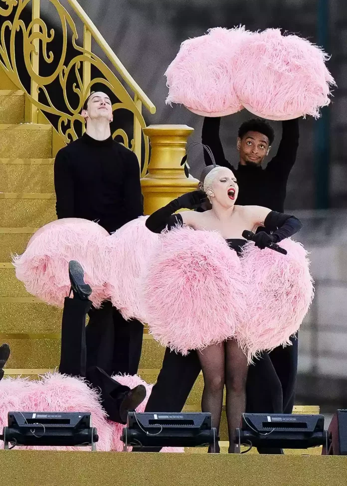 Lady Gaga performs at the 2024 Paris Olympics in Dior feathers.