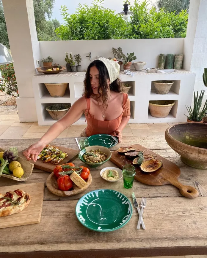 Woman at table with healthy food.