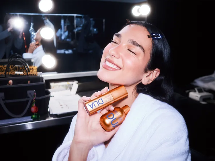 Dua Lipa with products.