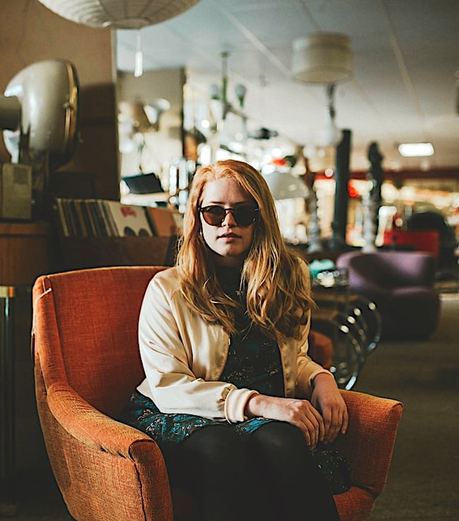 thrift-chair-woman Secondhand Shopping Saves $1.2B Annually and 1.8 Million Tons of CO2